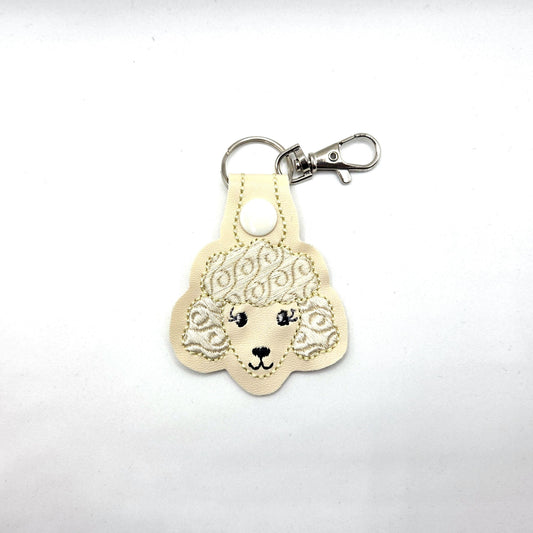 Poodle Head Keychain – Cream Embroidered Snap Tab